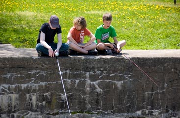 three young boys fishing