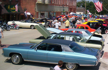 street lined with cars at car show